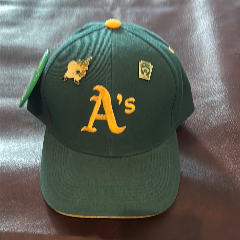 A’s baseball cap with baseball memorabilia-3 pins